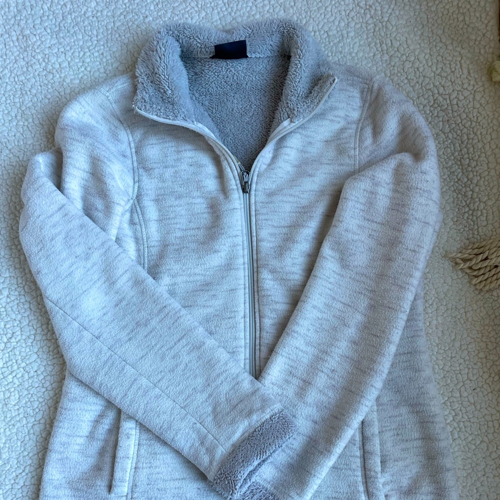 White and gray jacket size medium.